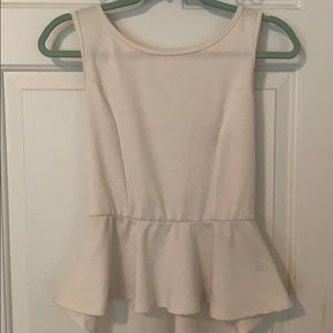 White peplum top with deep v back and bow